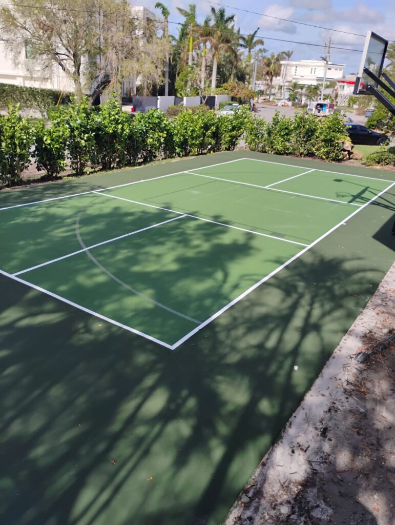 Empty outdoor pickleball court on a sunny day.